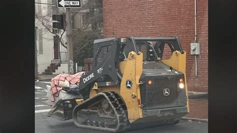 skid steer chase frederick md|Man drives John Deere farm equipment through Frederick, .